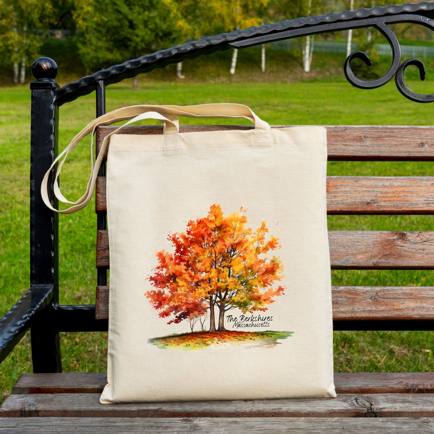Cotton tote bag with a watercolor maple tree design and the text “The Berkshires Massachusetts” printed on the front.