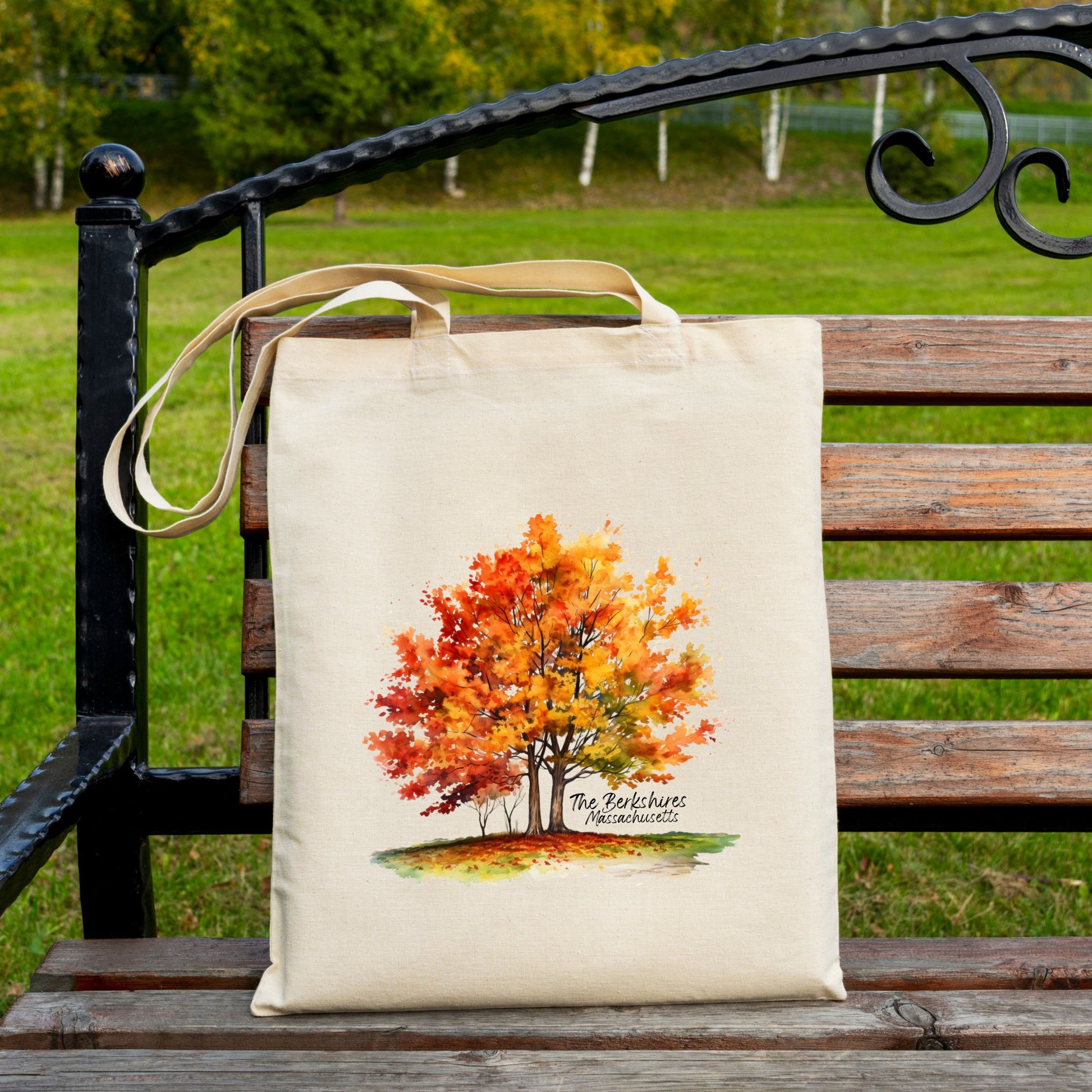 Cotton tote bag with a watercolor maple tree design and the text “The Berkshires Massachusetts” printed on the front.