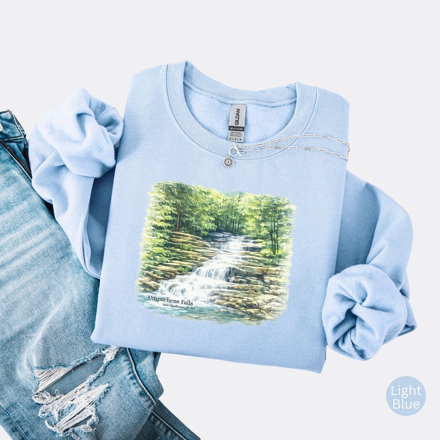 Umpachene Falls crewneck sweatshirt with waterfall design in the color light blue